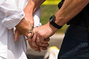 a guy being handcuffed