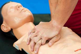 performing CPR on dummy