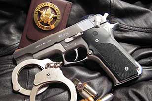 security badge with gun and handcuff